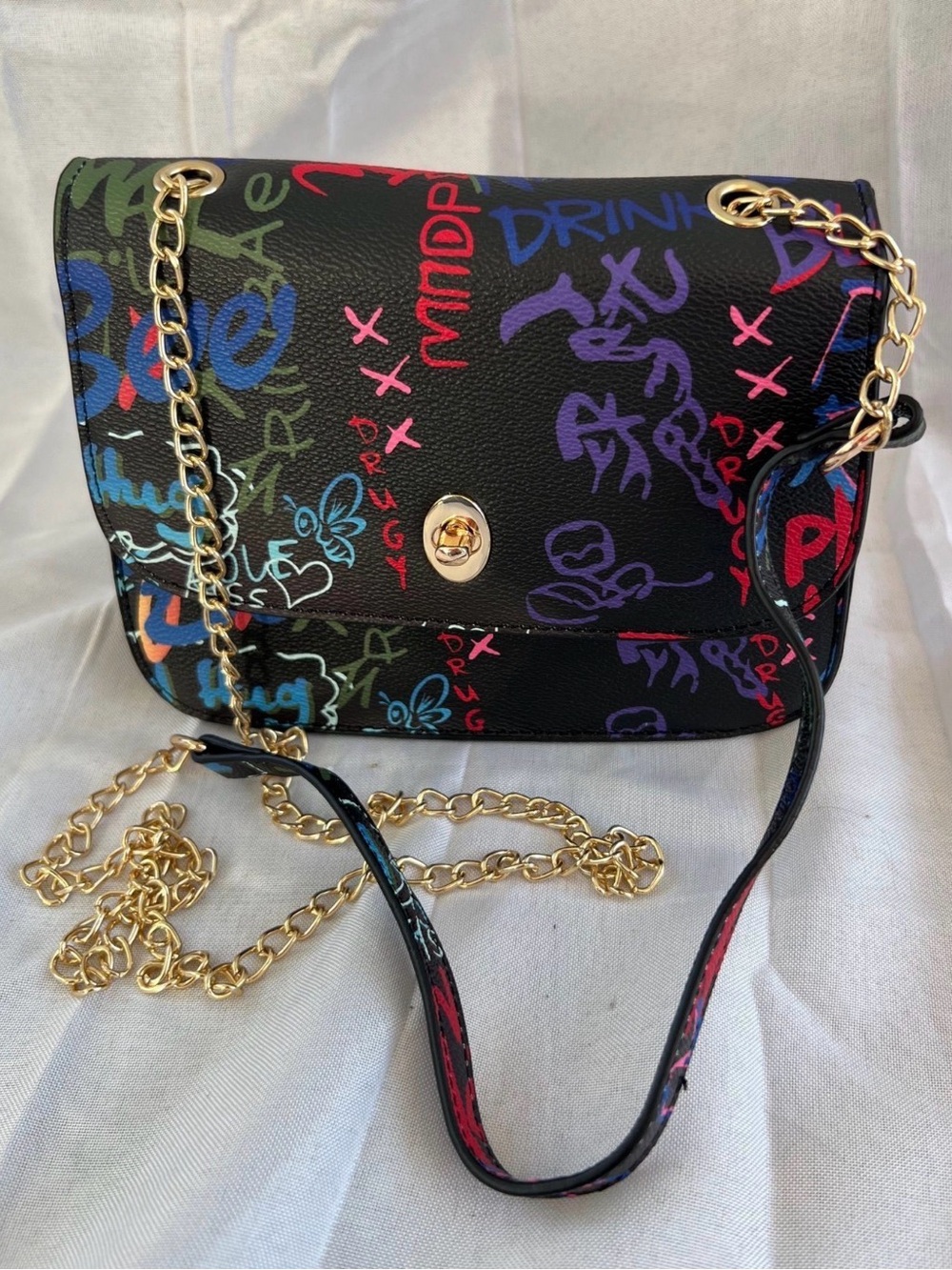Black Graffiti-Print Crossbody Bag with Gold Chain